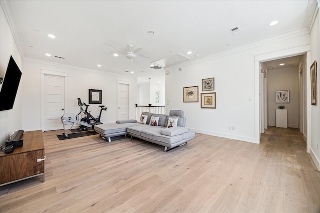 living area with crown molding, recessed lighting, visible vents, light wood-style flooring, and attic access