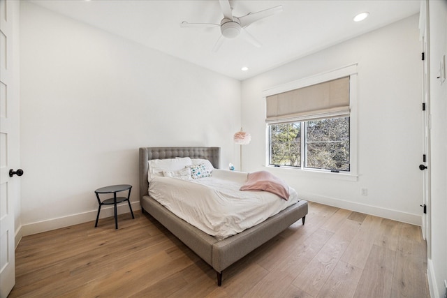 bedroom with light wood finished floors, recessed lighting, a ceiling fan, and baseboards