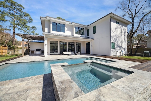 back of property featuring a standing seam roof, fence, a patio area, an outdoor living space, and a pergola