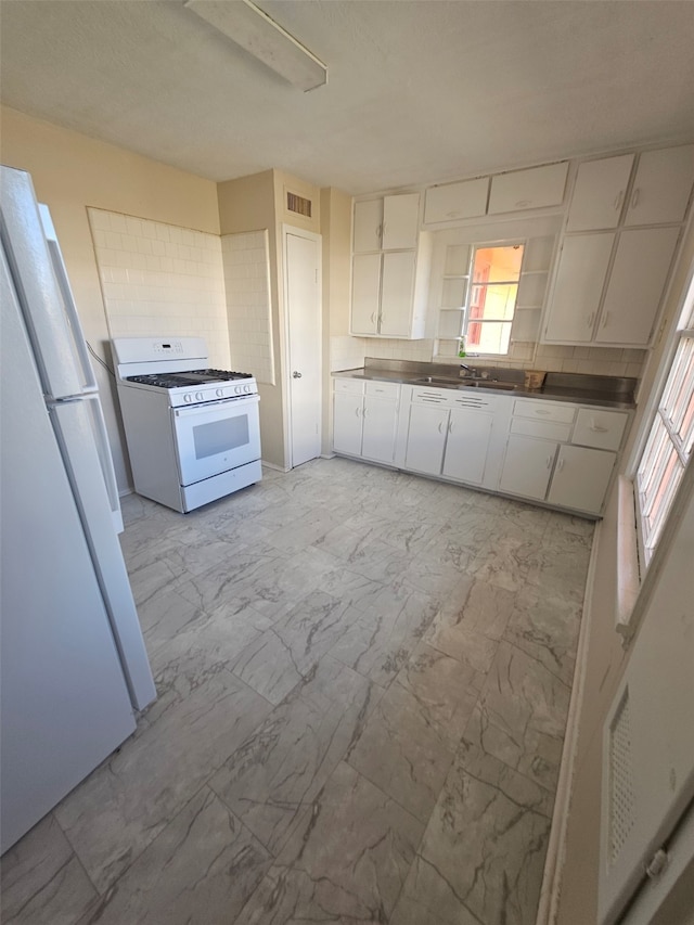 kitchen with white cabinetry, open shelves, white appliances, marble finish floor, and visible vents