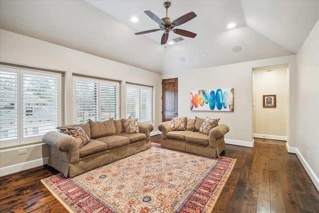 living area with dark wood finished floors, lofted ceiling, baseboards, and visible vents