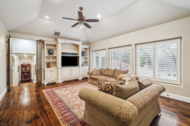 living area with visible vents, dark wood-type flooring, baseboards, ceiling fan, and vaulted ceiling