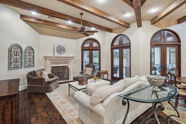 living room featuring visible vents, french doors, a fireplace, baseboards, and dark wood-style flooring