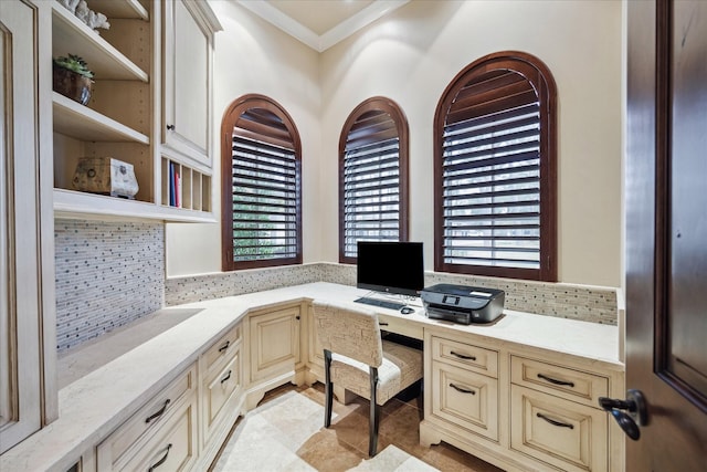 office featuring light tile patterned floors, built in desk, and ornamental molding