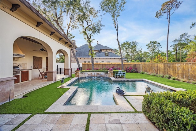 view of pool with a fenced backyard, exterior kitchen, a fenced in pool, ceiling fan, and a patio area