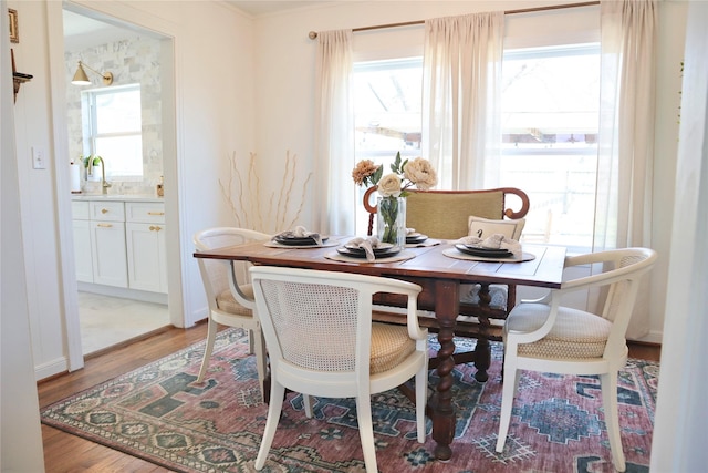 dining area featuring light wood-style floors