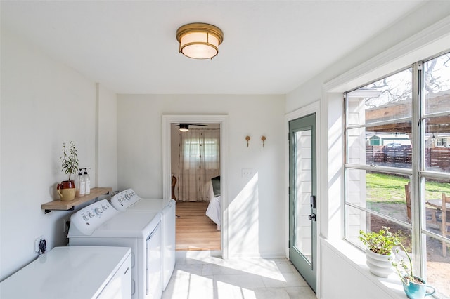 laundry room with light tile patterned floors, laundry area, and independent washer and dryer