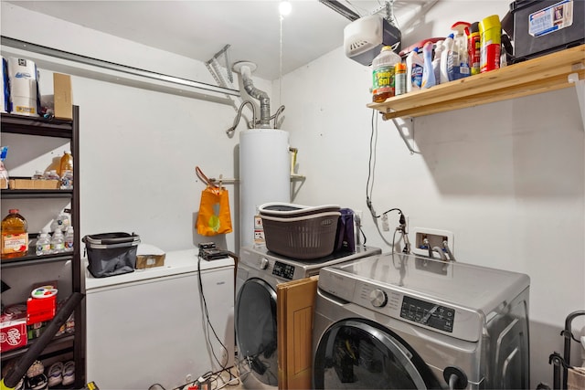 laundry room with washer and dryer, laundry area, and water heater