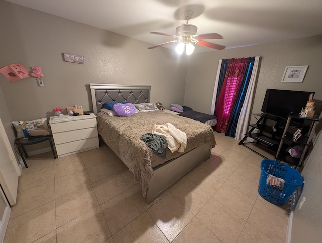 bedroom with light tile patterned floors and a ceiling fan