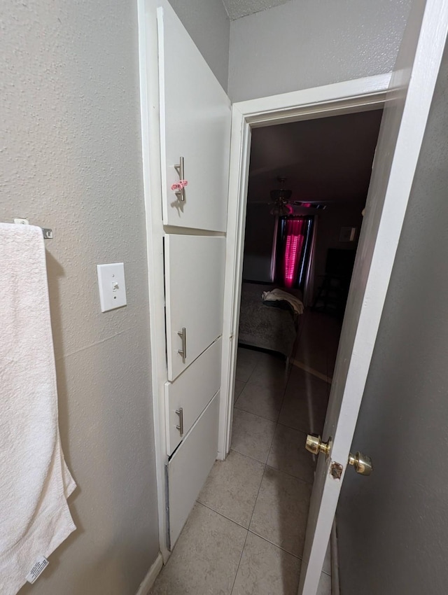 hallway featuring light tile patterned floors