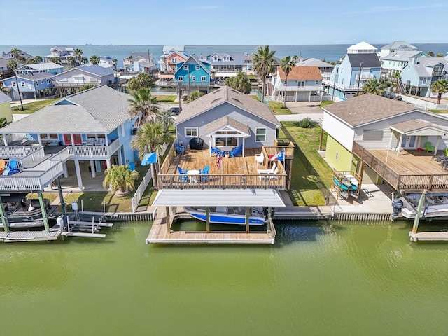 birds eye view of property featuring a water view and a residential view