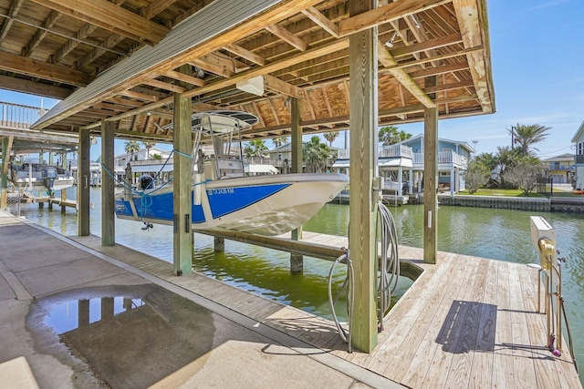 dock area featuring a water view and boat lift