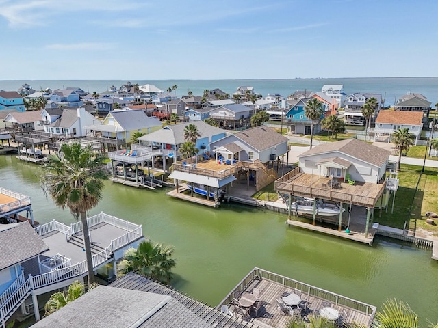 birds eye view of property with a residential view and a water view