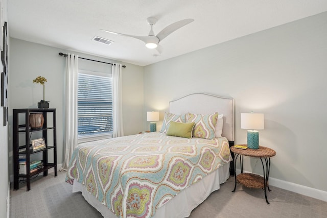 bedroom featuring carpet floors, visible vents, baseboards, and a ceiling fan