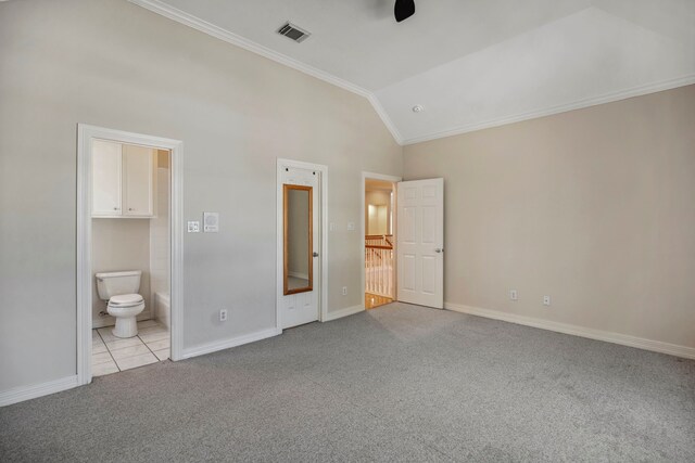 unfurnished bedroom with visible vents, crown molding, vaulted ceiling, carpet flooring, and ensuite bath