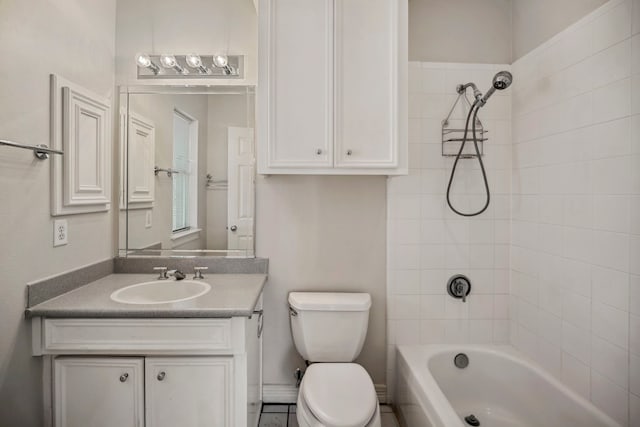 full bath featuring washtub / shower combination, toilet, and vanity