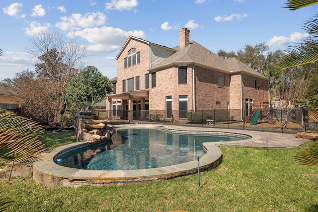 view of pool featuring a yard, a playground, and fence