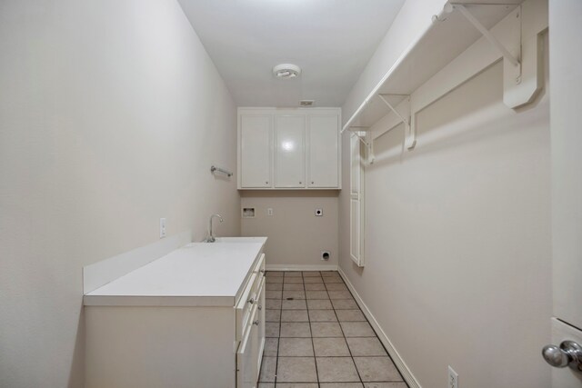 clothes washing area with washer hookup, a sink, cabinet space, light tile patterned floors, and hookup for an electric dryer