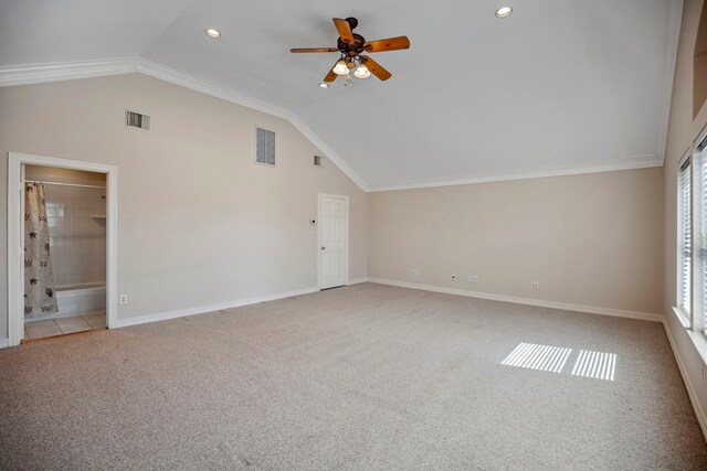 interior space featuring baseboards, visible vents, carpet floors, and lofted ceiling