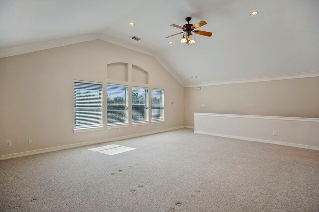 additional living space featuring light colored carpet, baseboards, visible vents, and a ceiling fan