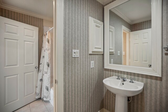 full bathroom with a shower with shower curtain, ornamental molding, tile patterned flooring, and wallpapered walls