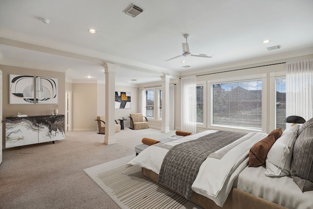 carpeted bedroom featuring decorative columns, baseboards, visible vents, and ornamental molding