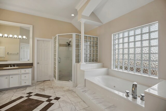 bathroom with decorative columns, lofted ceiling, a stall shower, and vanity