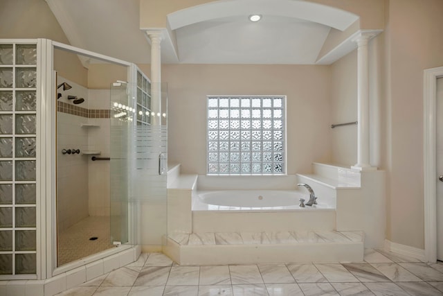 full bath with decorative columns, a bath, a stall shower, and marble finish floor