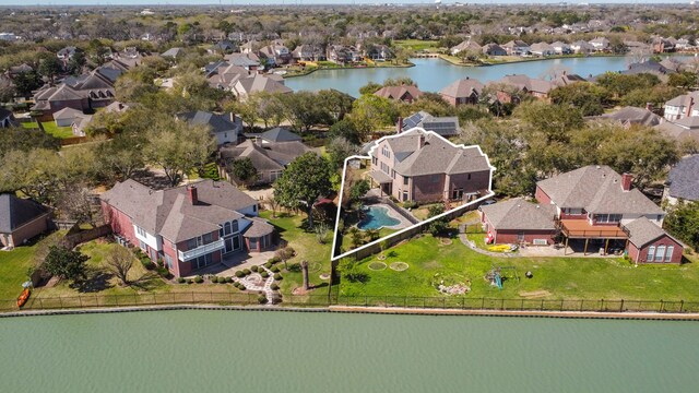 bird's eye view with a residential view and a water view