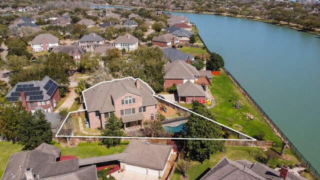 aerial view featuring a residential view and a water view