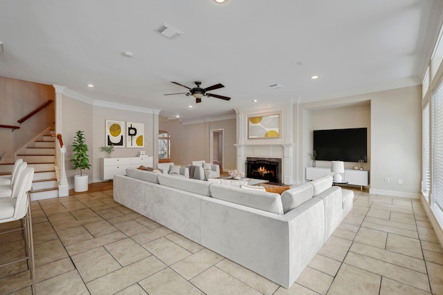 4207 Clearwater Ct, Missouri City, TX 77459 - unfurnished living room with stairs, visible vents, a ceiling fan, and crown molding