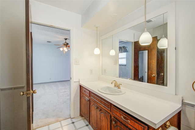 bathroom featuring visible vents, ceiling fan, vanity, and tile patterned floors