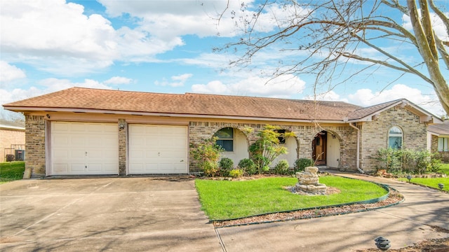 ranch-style house featuring a garage, concrete driveway, and brick siding