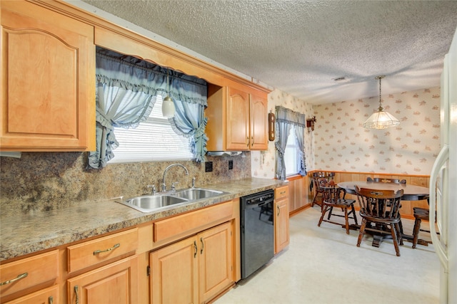 kitchen featuring a textured ceiling, a sink, wainscoting, dishwasher, and wallpapered walls