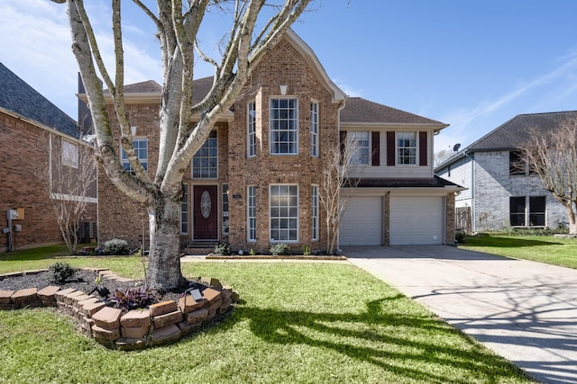 traditional-style home with a garage, a front yard, brick siding, and driveway