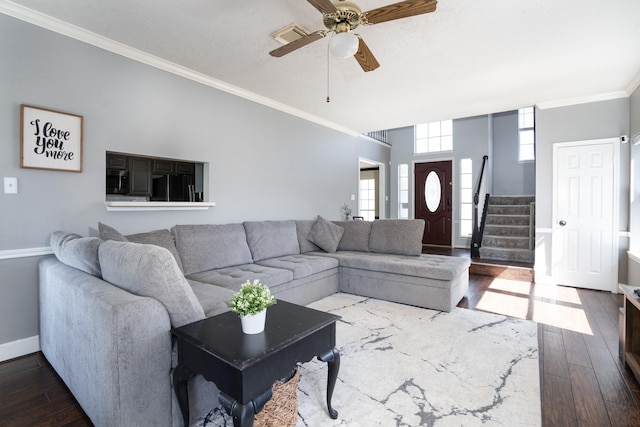 living room with visible vents, ornamental molding, stairway, and hardwood / wood-style floors