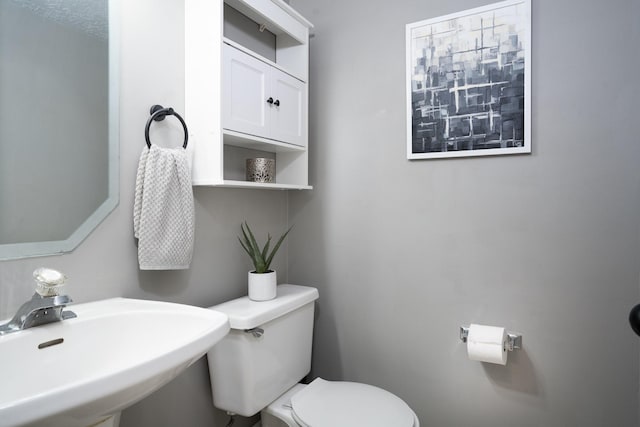 bathroom with a sink and toilet