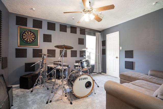 interior space with a ceiling fan, visible vents, baseboards, and a textured ceiling