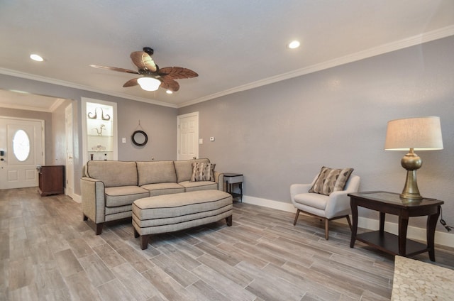 living room with baseboards, light wood-type flooring, ornamental molding, recessed lighting, and a ceiling fan