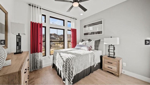 409 Silver Moon Way, Katy, TX 77493 - bedroom with light wood-style floors, baseboards, recessed lighting, and ceiling fan