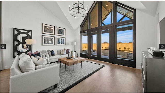 409 Silver Moon Way, Katy, TX 77493 - living area featuring a chandelier, wood finished floors, and high vaulted ceiling