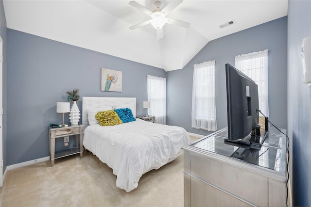 bedroom with light colored carpet, visible vents, a ceiling fan, vaulted ceiling, and baseboards