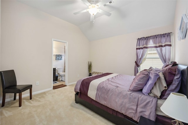 bedroom featuring connected bathroom, carpet floors, visible vents, baseboards, and vaulted ceiling