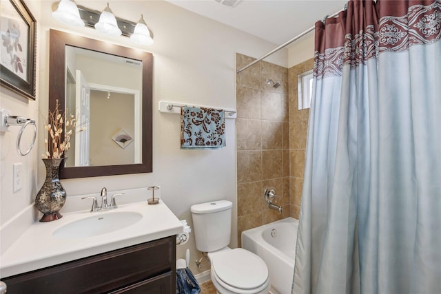 bathroom with toilet, shower / tub combo, visible vents, and vanity