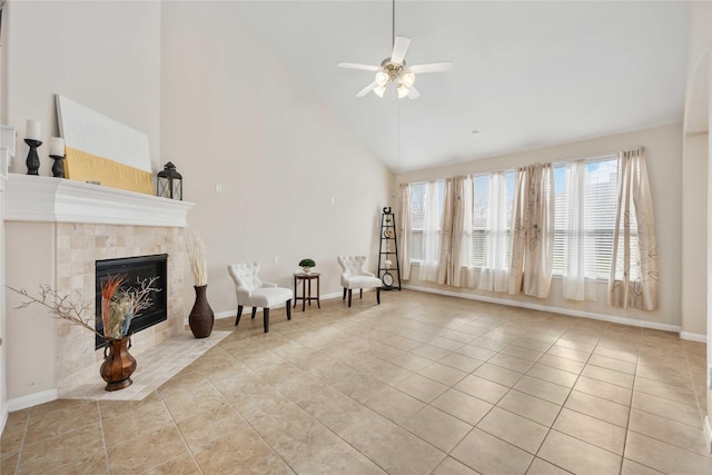 unfurnished room featuring baseboards, tile patterned flooring, high vaulted ceiling, and a tiled fireplace