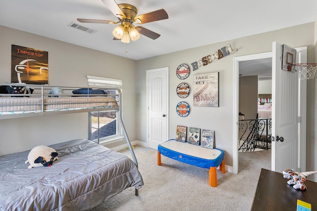 bedroom featuring visible vents, baseboards, carpet, and a ceiling fan