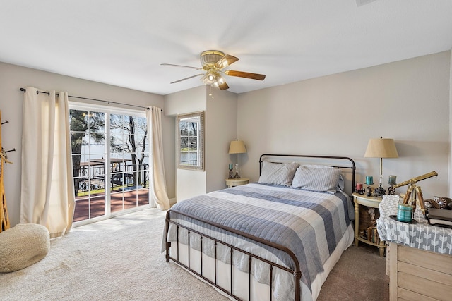 carpeted bedroom featuring ceiling fan and access to exterior