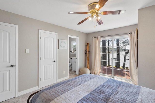 carpeted bedroom featuring a ceiling fan, ensuite bathroom, baseboards, and access to outside