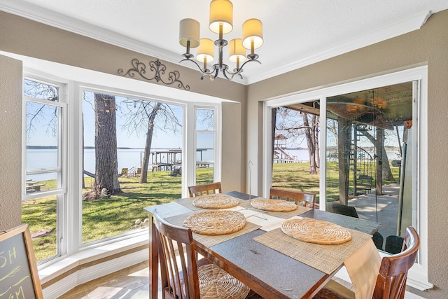 sunroom featuring plenty of natural light and a chandelier