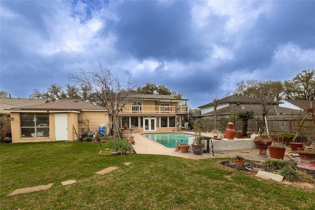 back of property featuring french doors, a patio, a lawn, fence, and stairs